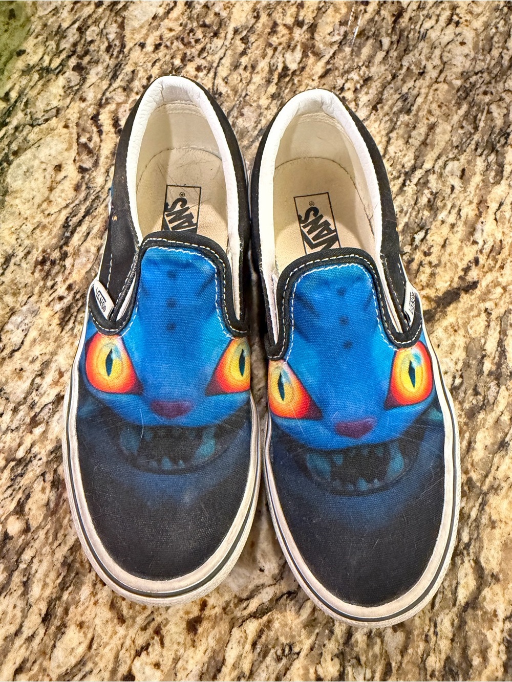 Vans Kids Slip-On Shoes with Bright Blue Monster Face and Yellow-Orange Eyes